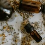 A collection of amber bottles with essential oils surrounded by dried herbs and flowers, perfect for aromatherapy and relaxation.